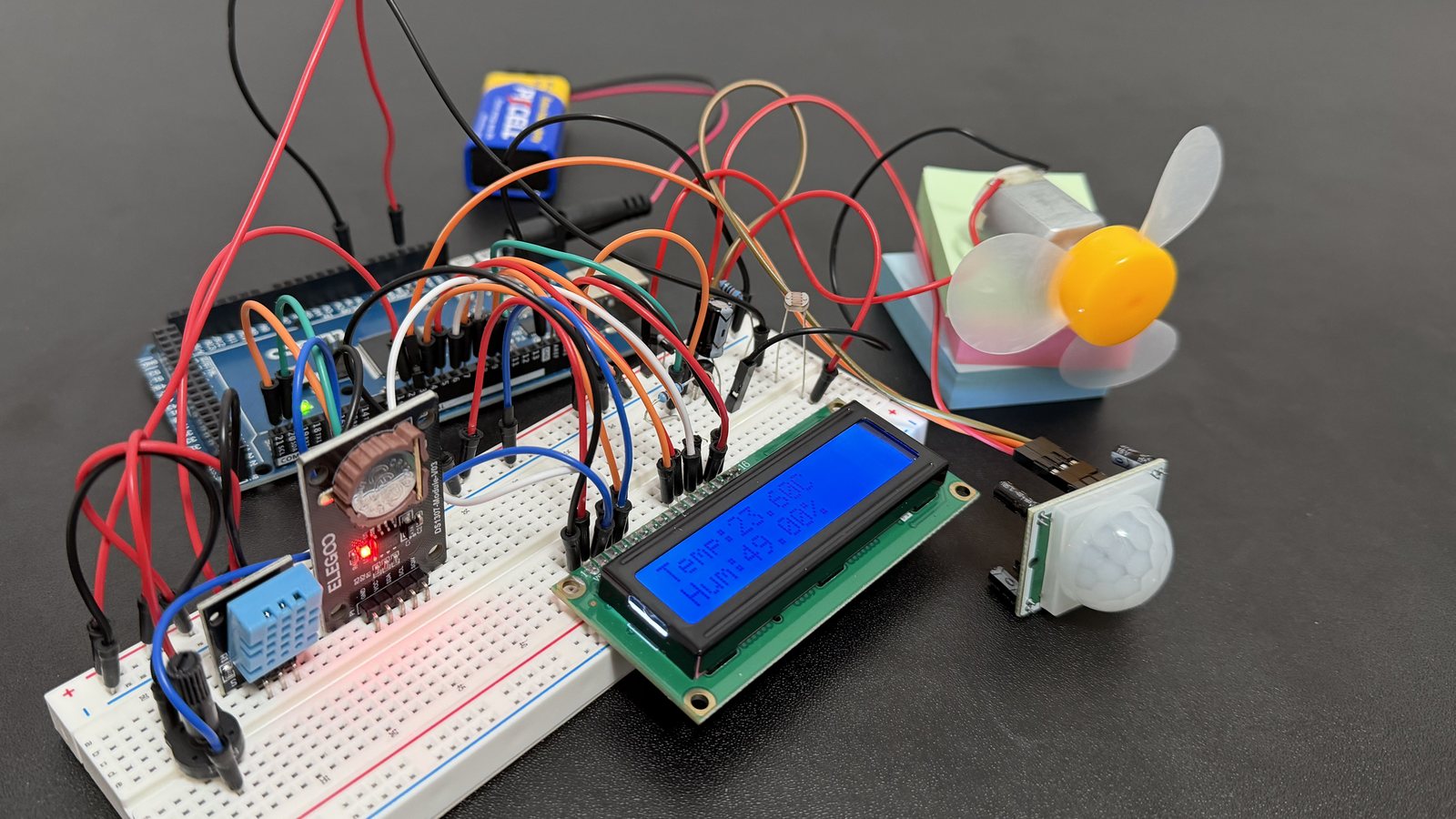 The full Comfort Guardian build, with the LCD lit and the sensors and fan visible
