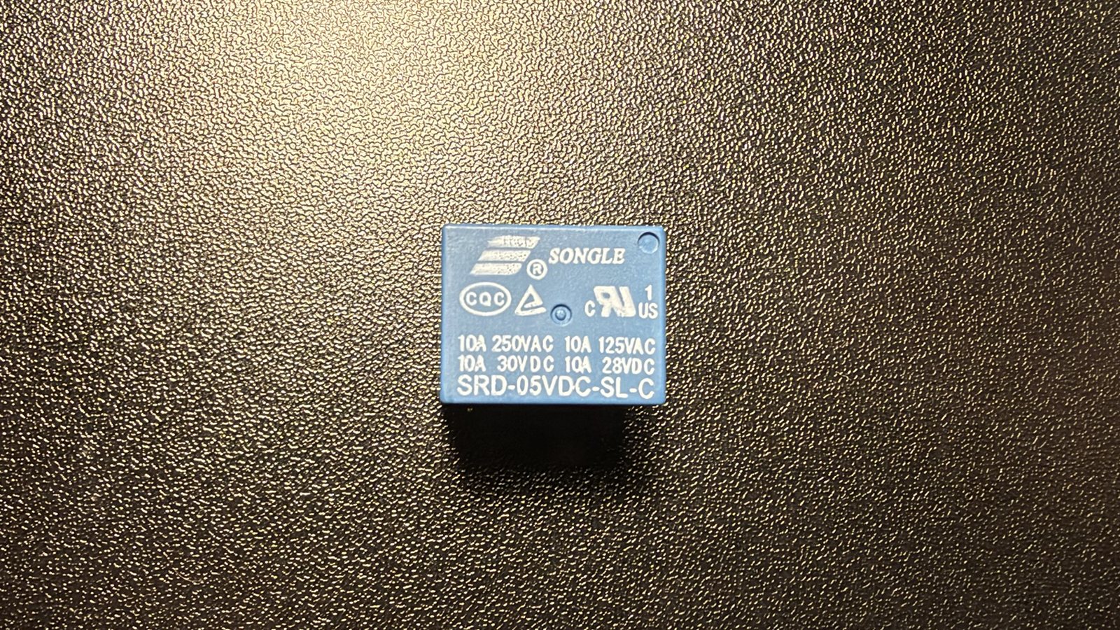 Close-up of the bare relay with its part number visible
